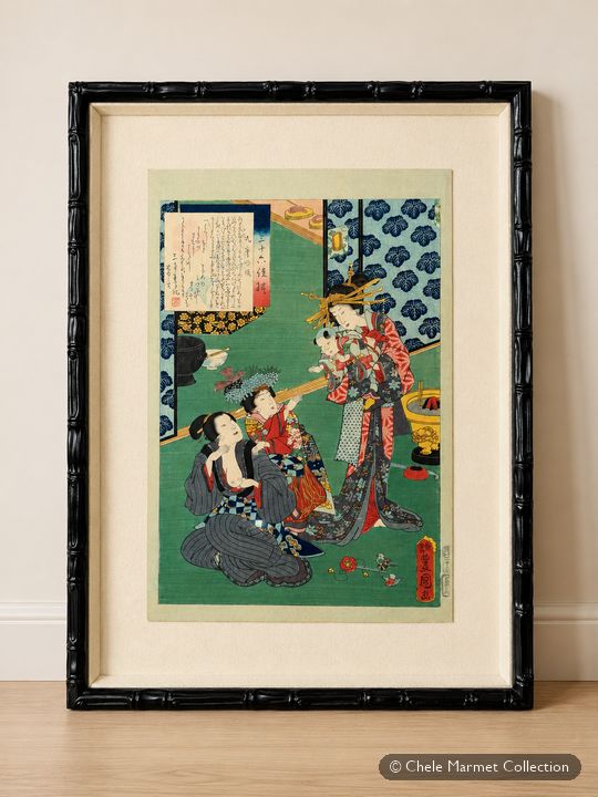 Framed Japanese print of a woman in a green patterned kimono nursing a child.