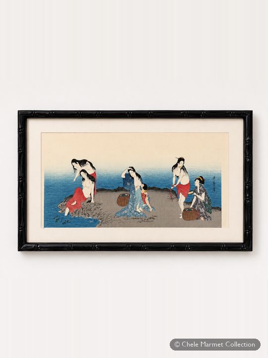 Framed horizontal Japanese print of women by the sea, one nursing a baby.