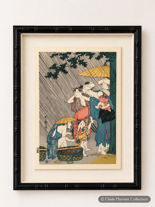 Framed Japanese print of a woman in the rain with an umbrella and a child.