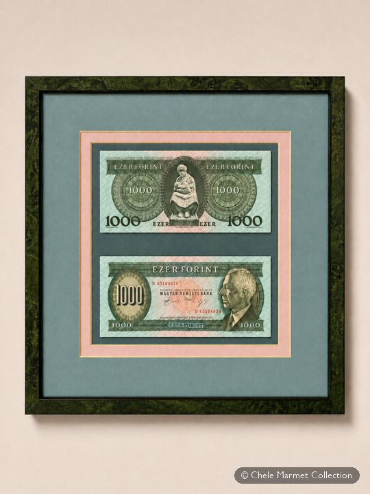 Framed pair of green Hungarian banknotes.