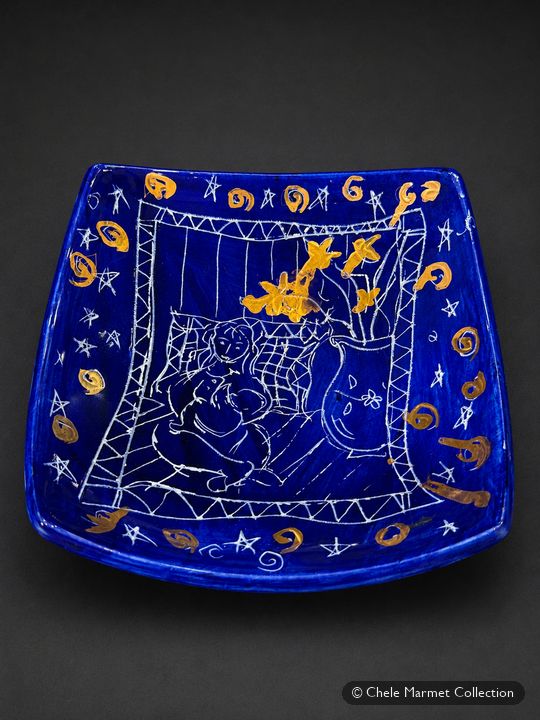 Square cobalt-blue plate painted in white and gold with a mother and baby.